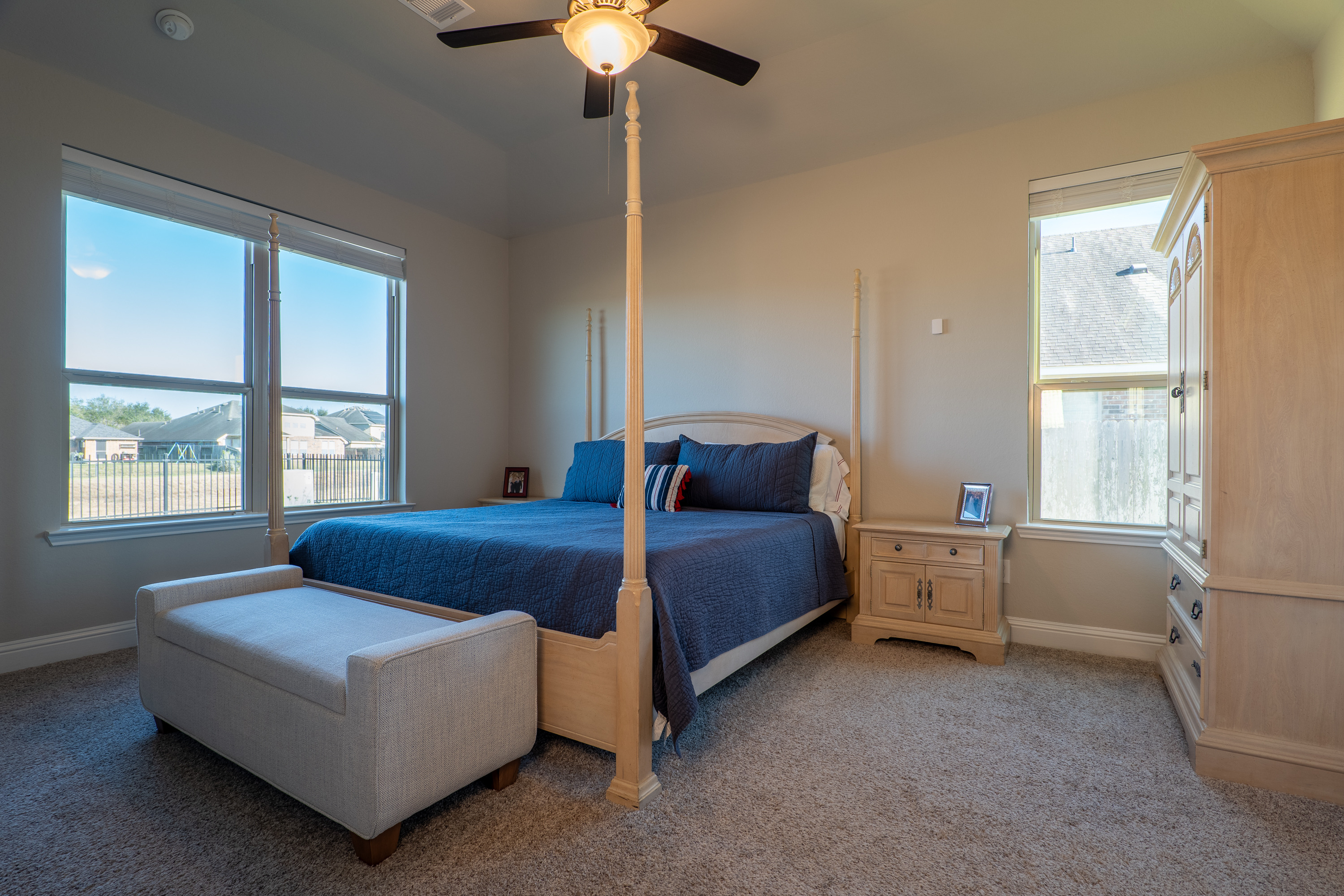 Downstairs primary bedroom with greenbelt views. No nearby bedrooms and no living space overhead.