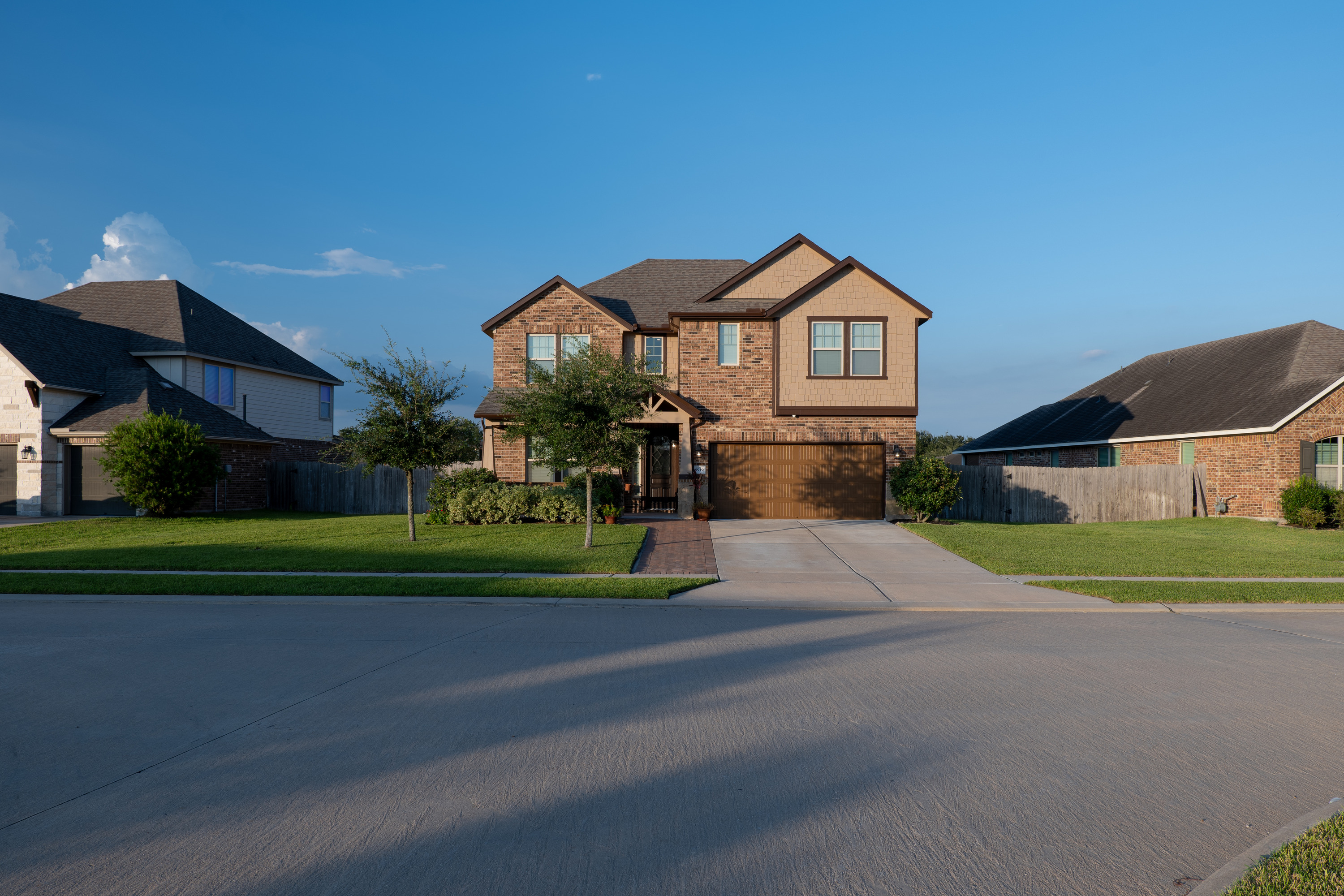 Room to breathe. Wide front lawn with extra street frontage and space between side neighbors.