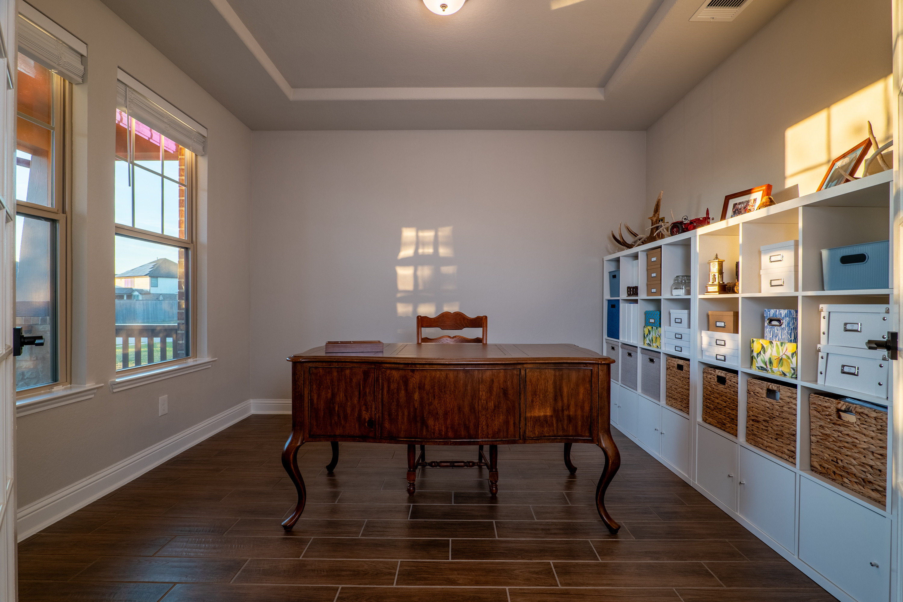Front-facing study with a tray ceiling.