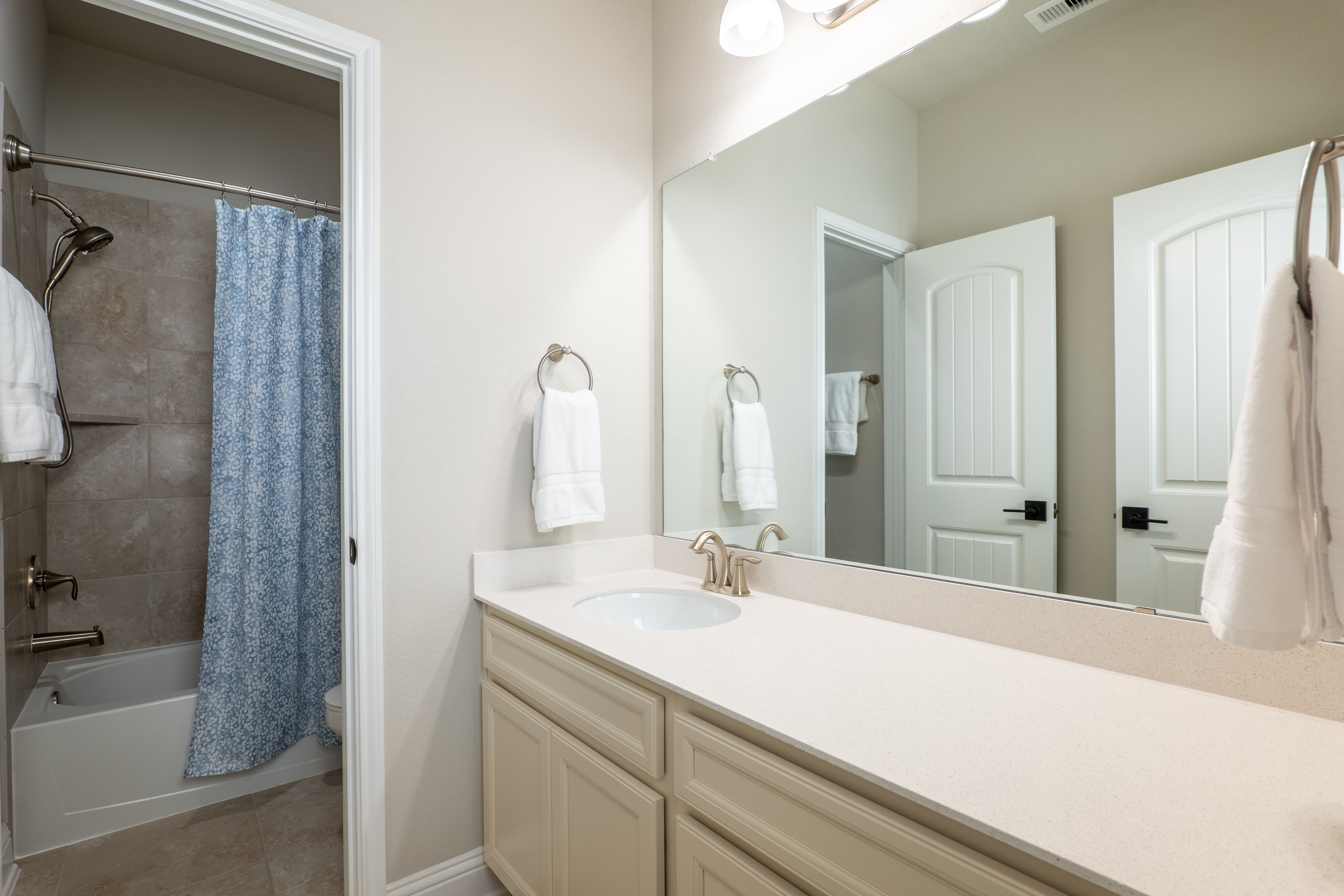 Upstairs full bath with the vanity separated from the tub/shower and toilet.