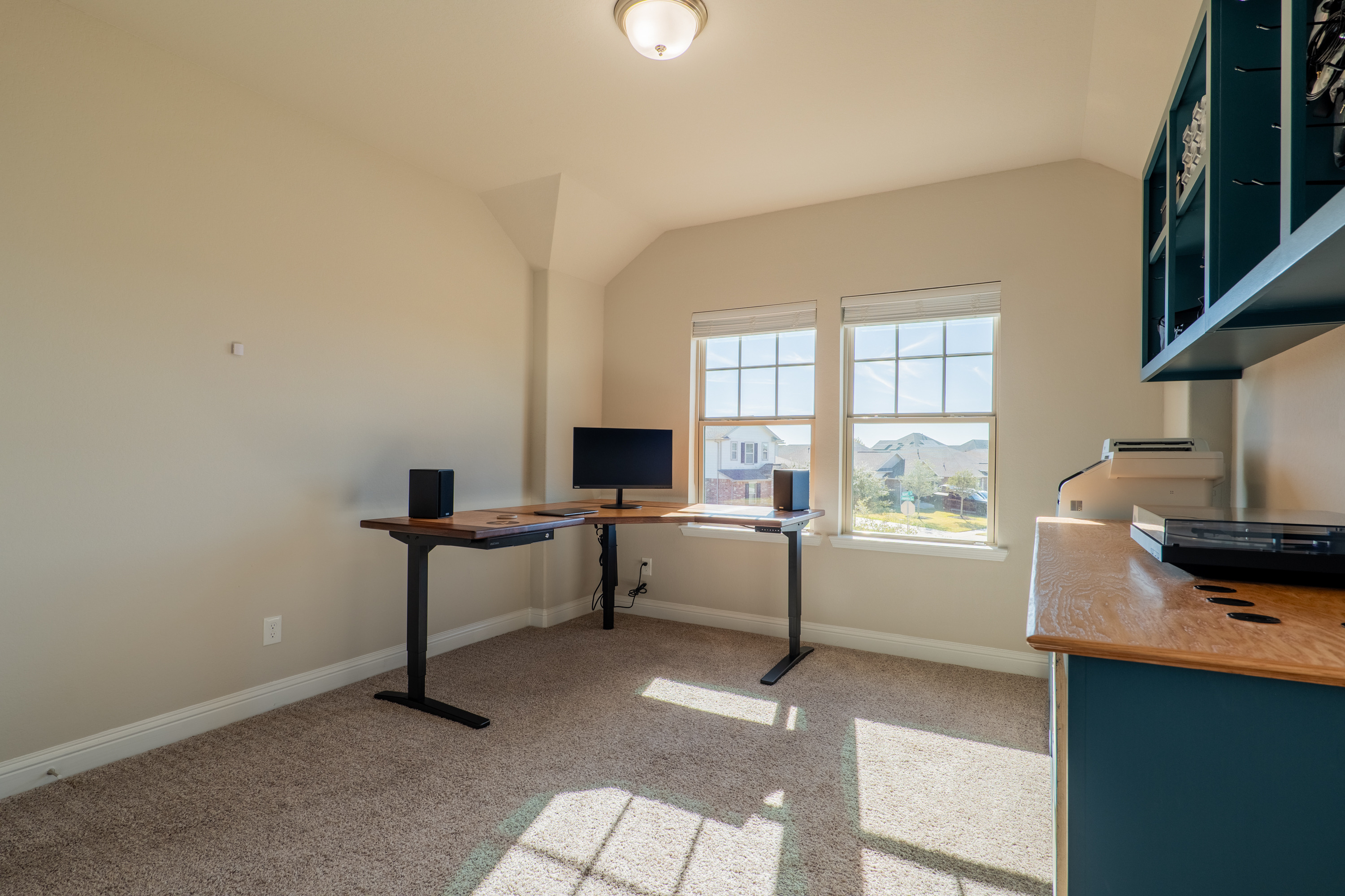 Fourth bedroom, currently used as an office, in its own wing across the landing from the paired bedrooms.