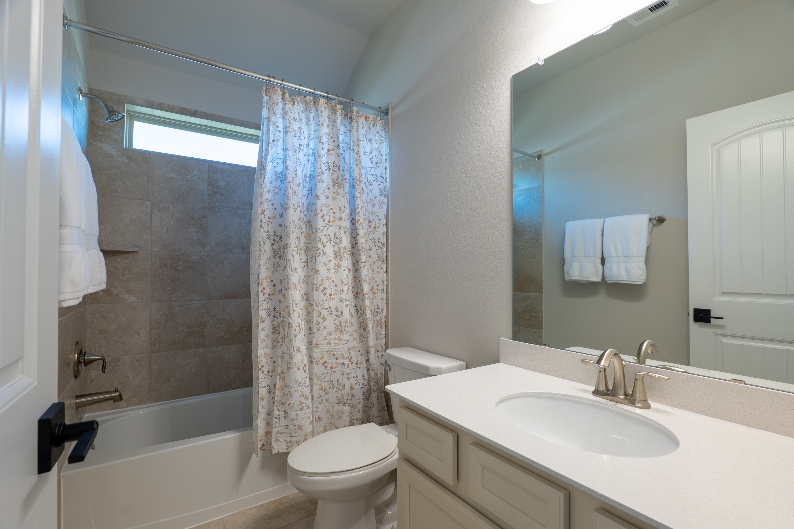Second upstairs full bath with tub/shower combination.