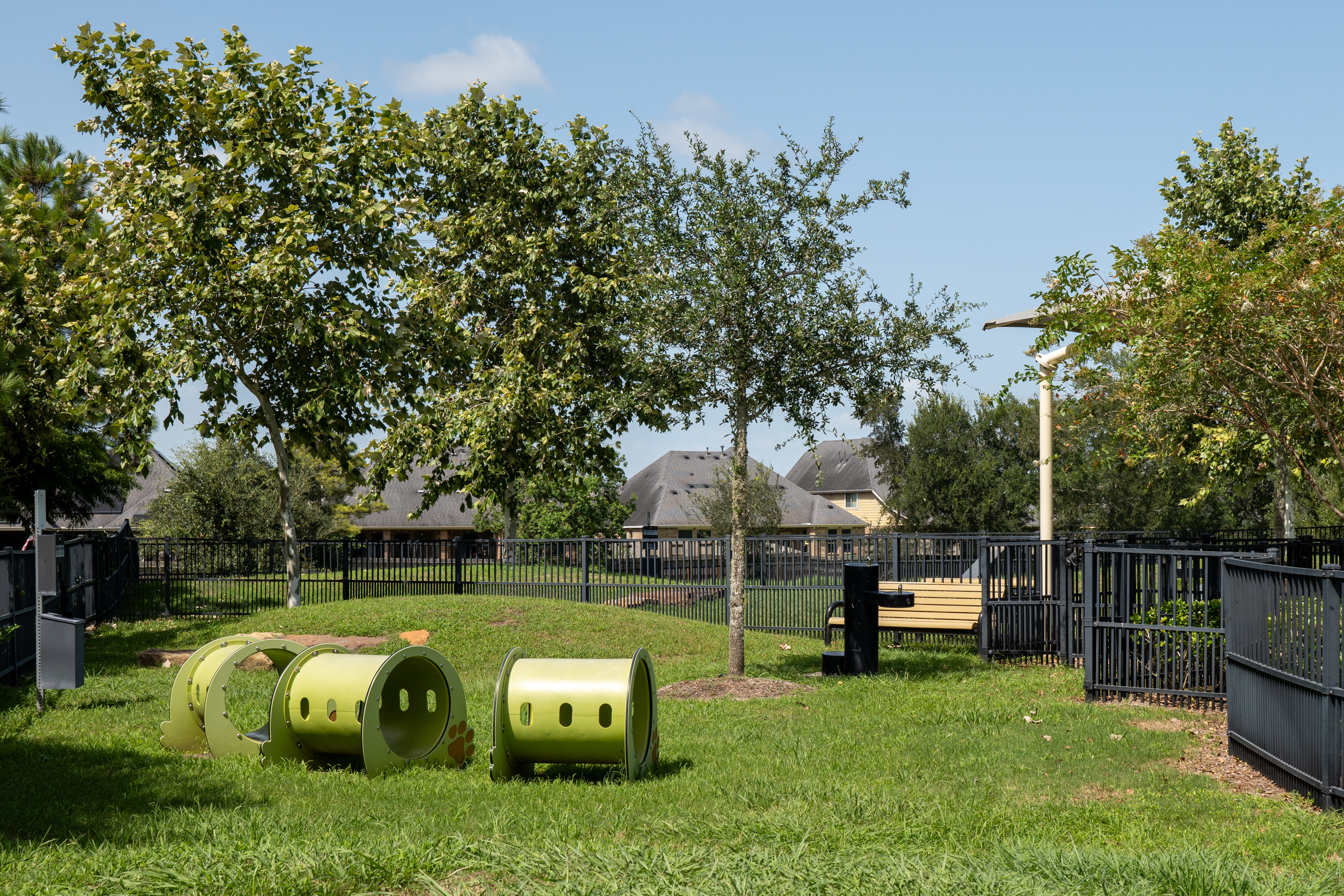 Japonica Dog Park with two separate fenced areas, benches, and watering facilities.