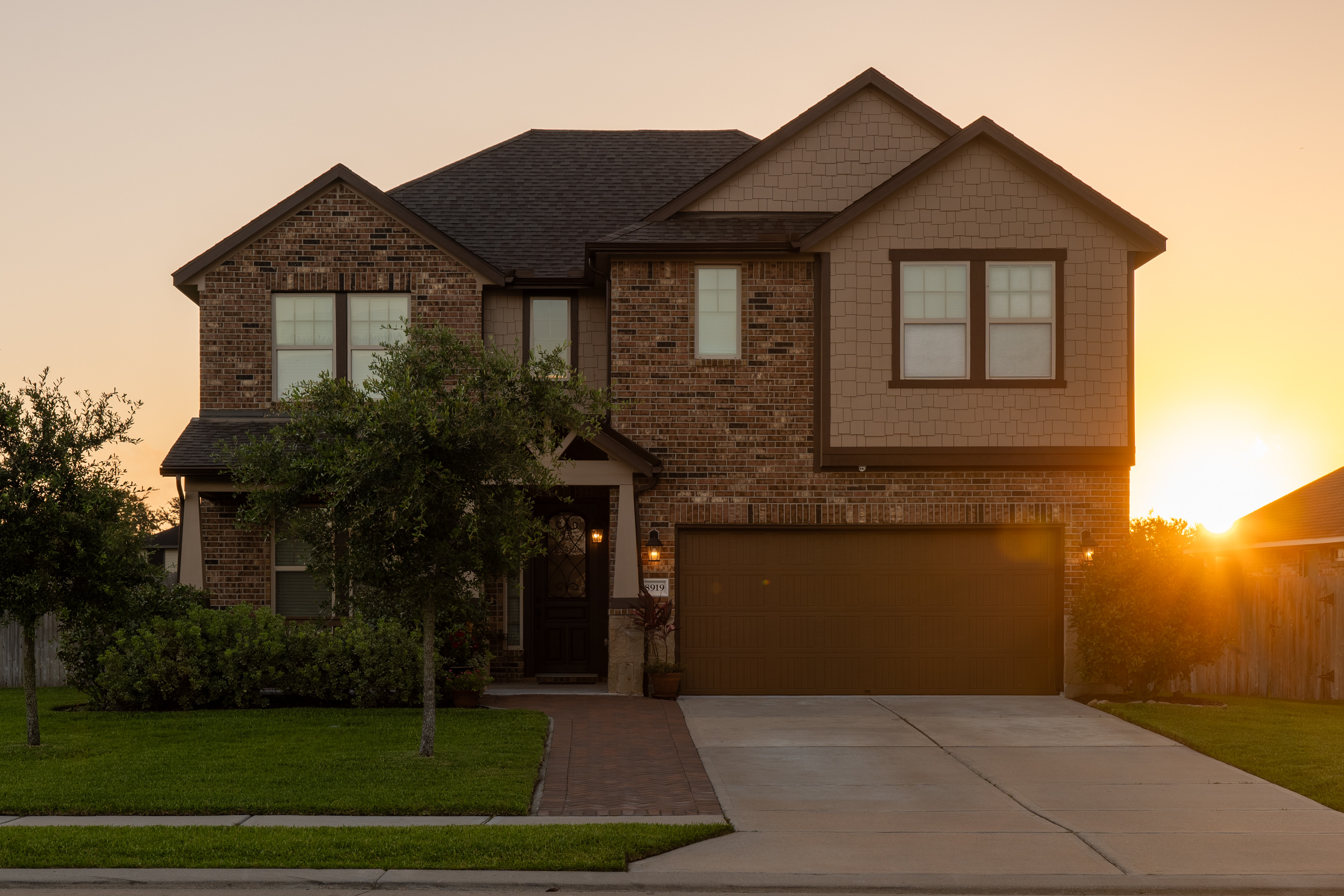 Sunrise behind 8919 Japonica Drive.