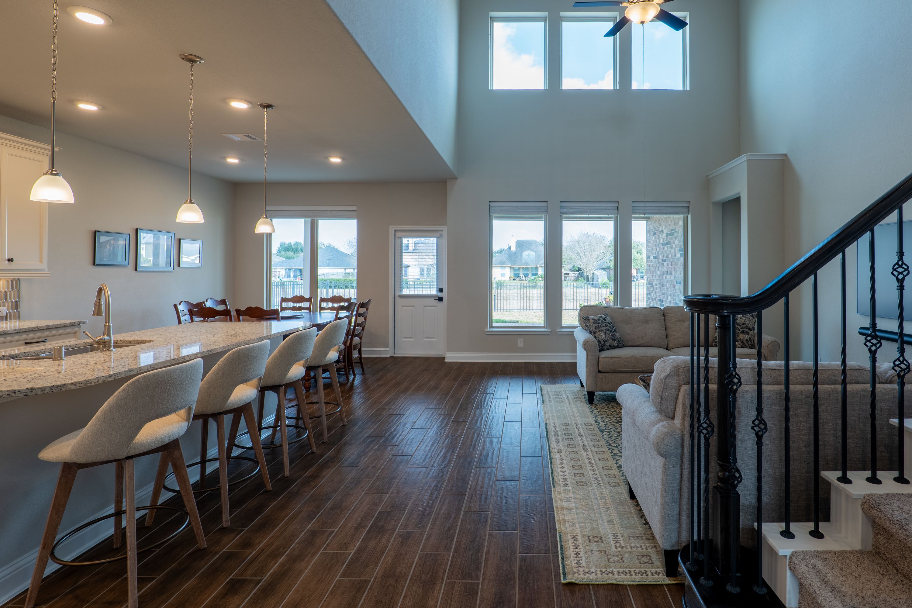 Two-story great room overlooks a greenbelt. Lots of light.
